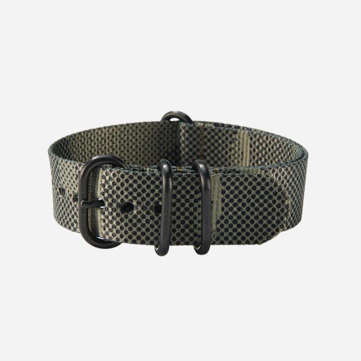 A dark green one piece watch band from Nixon.